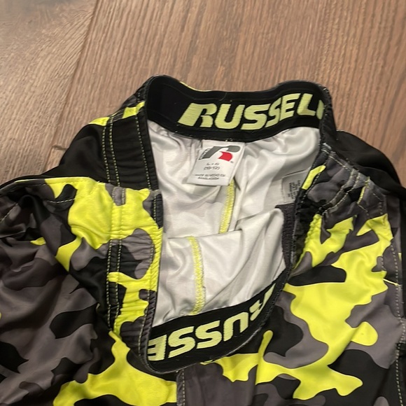 two basketball shorts both red are mediums and camp is large - Picture 4 of 4